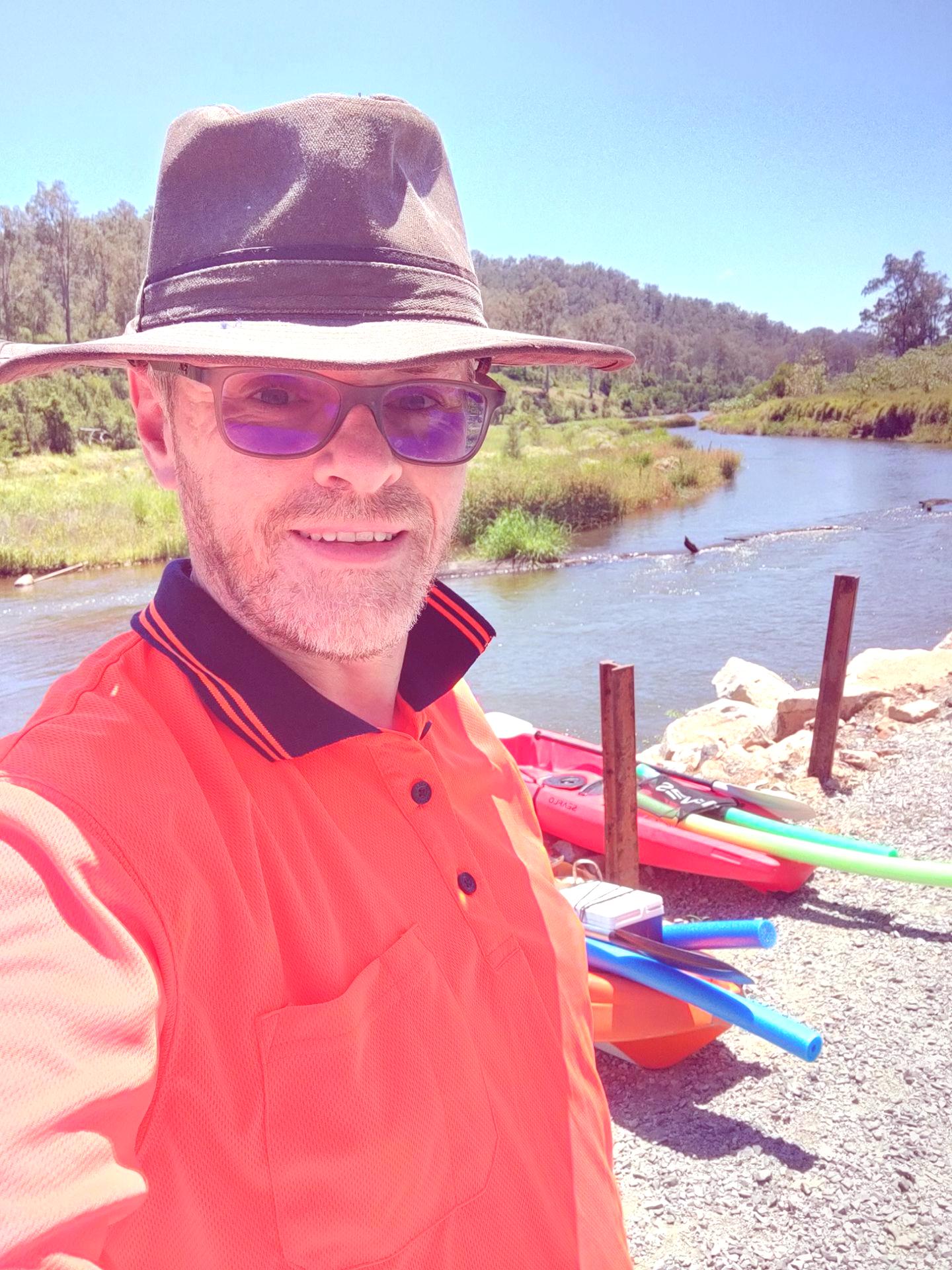 photo of a man kayaking